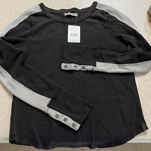 Free People thermal like top with button detail on sleeves. Brand new.